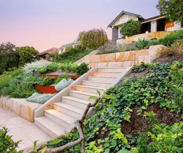 How to Deal With Sloped Yards: Terracing & Retaining Walls