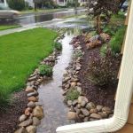 How to Build a Dry Creek Bed for Drainage & Visual Appeal