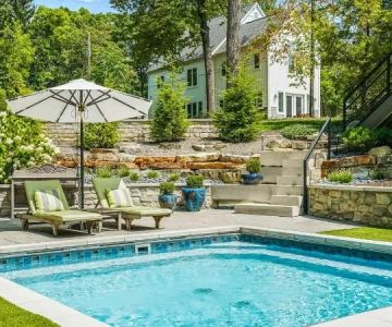 How to Landscape Around a Pool With Height & Depth